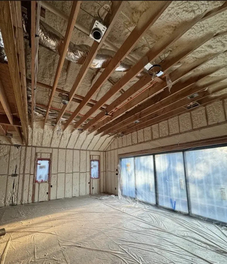 Interior walls and ceiling insulated with spray foam during new construction in Roswell